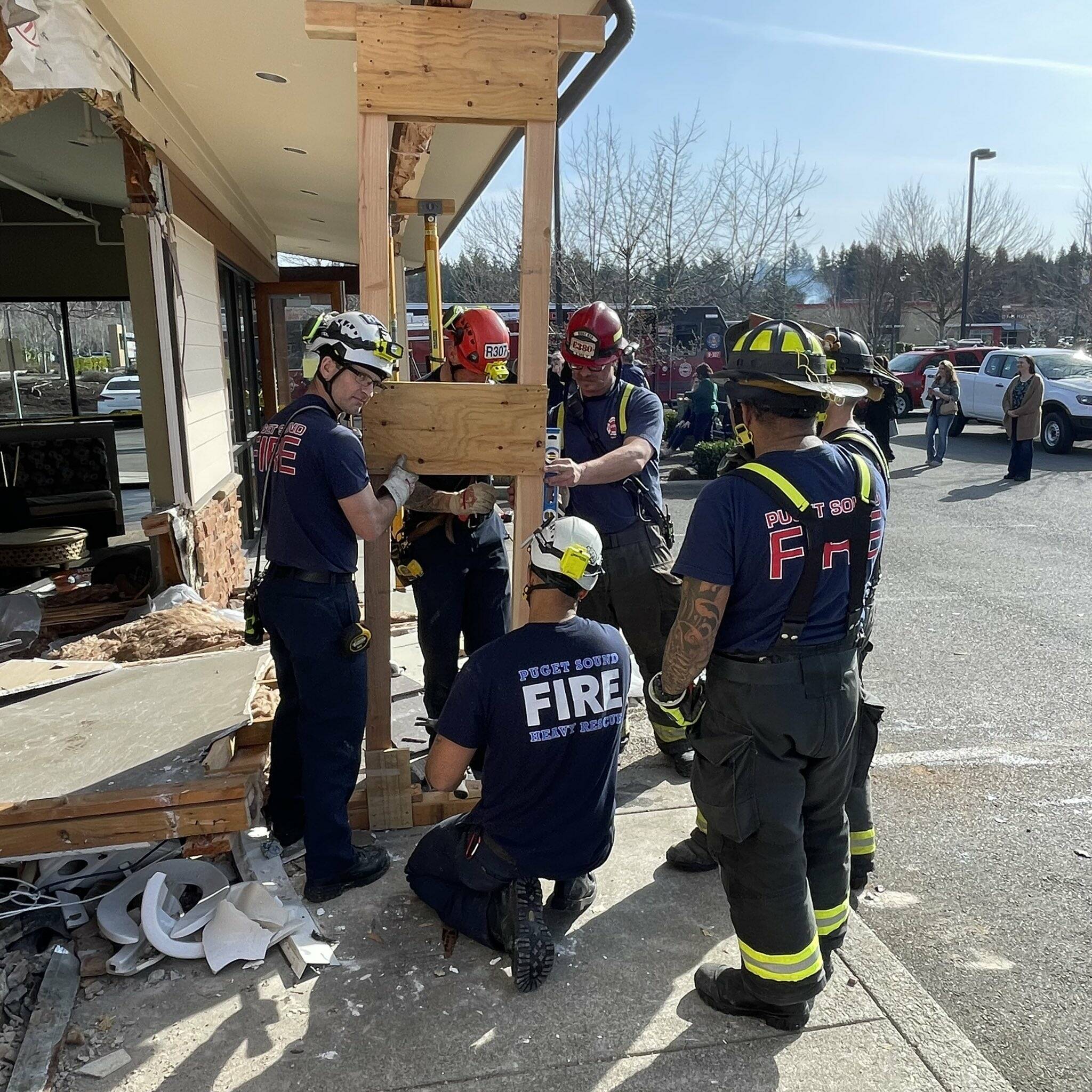Puget Sound Fire’s Heavy Team added additional emergency shoring to the unstable roofing once the dumptruck was removed. Photo courtesy of Puget Sound Regional Fire Authority.