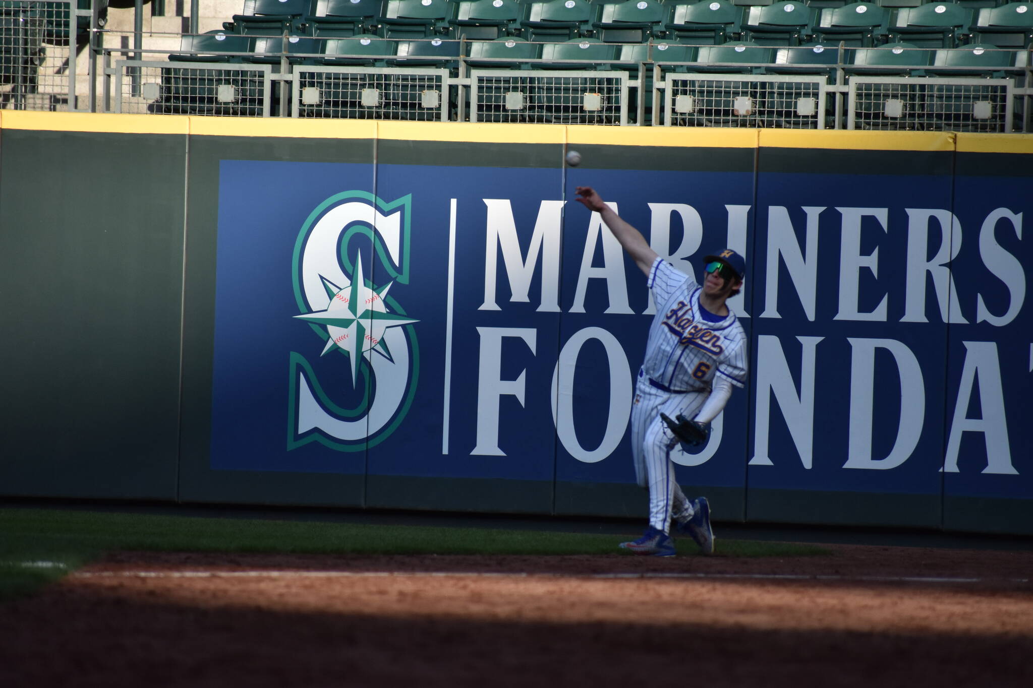 Hazen’s Jason Grossnickle (12) makes a throw to second base during warm-ups.
