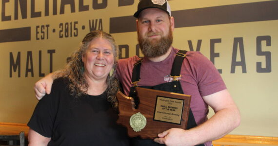 Four Generals co-owners and mother and son Mary Hudspeth and Ross Hudspeth pose with their “Small Brewery of the Year” plaque. Bailey Jo Josie / Renton Reporter