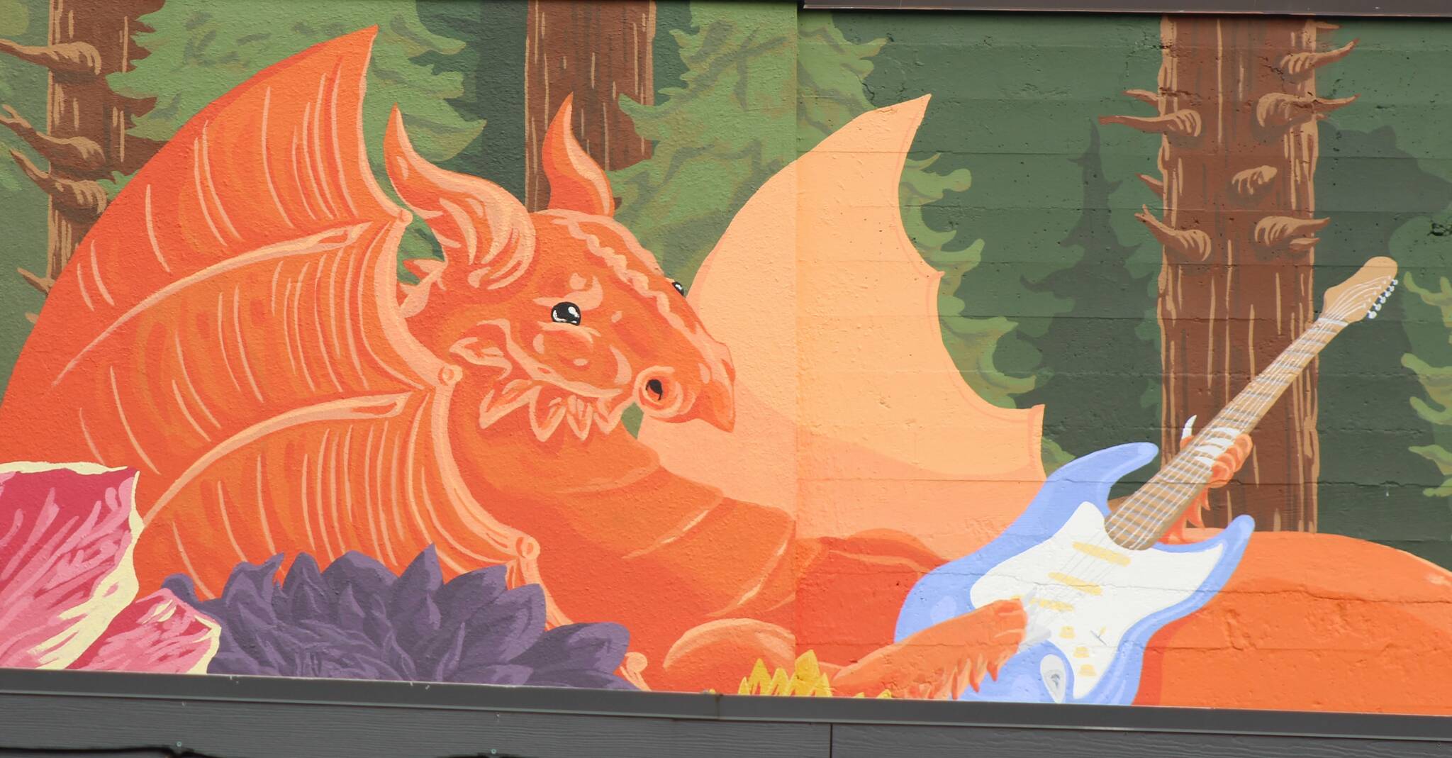 Bailey Jo Josie / Renton Reporter 
A mural of a dragon playing guitar in downtown Renton.