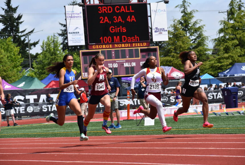 <p>Kayla Kittrell on her way to a podium position in the 100-meter sprint. Ben Ray / The Reporter</p>