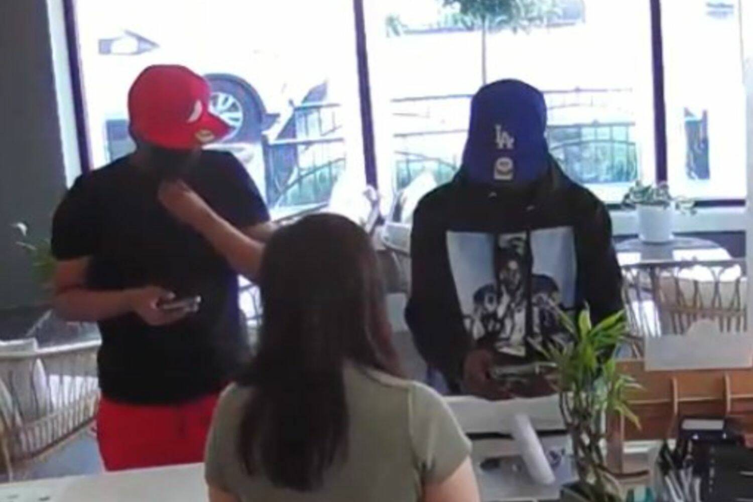 Screenshot from RPD Facebook post
Scam suspects caught on security video in Downtown Renton.