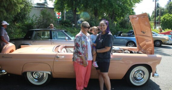Pictured left to right: Carol McGraw, Serena McGraw Boyer and Priscilla McGraw Boyer standing in front of their family car, a 1956 Ford Thunderbird. (Photo by Annika Hauer/For the Reporter)