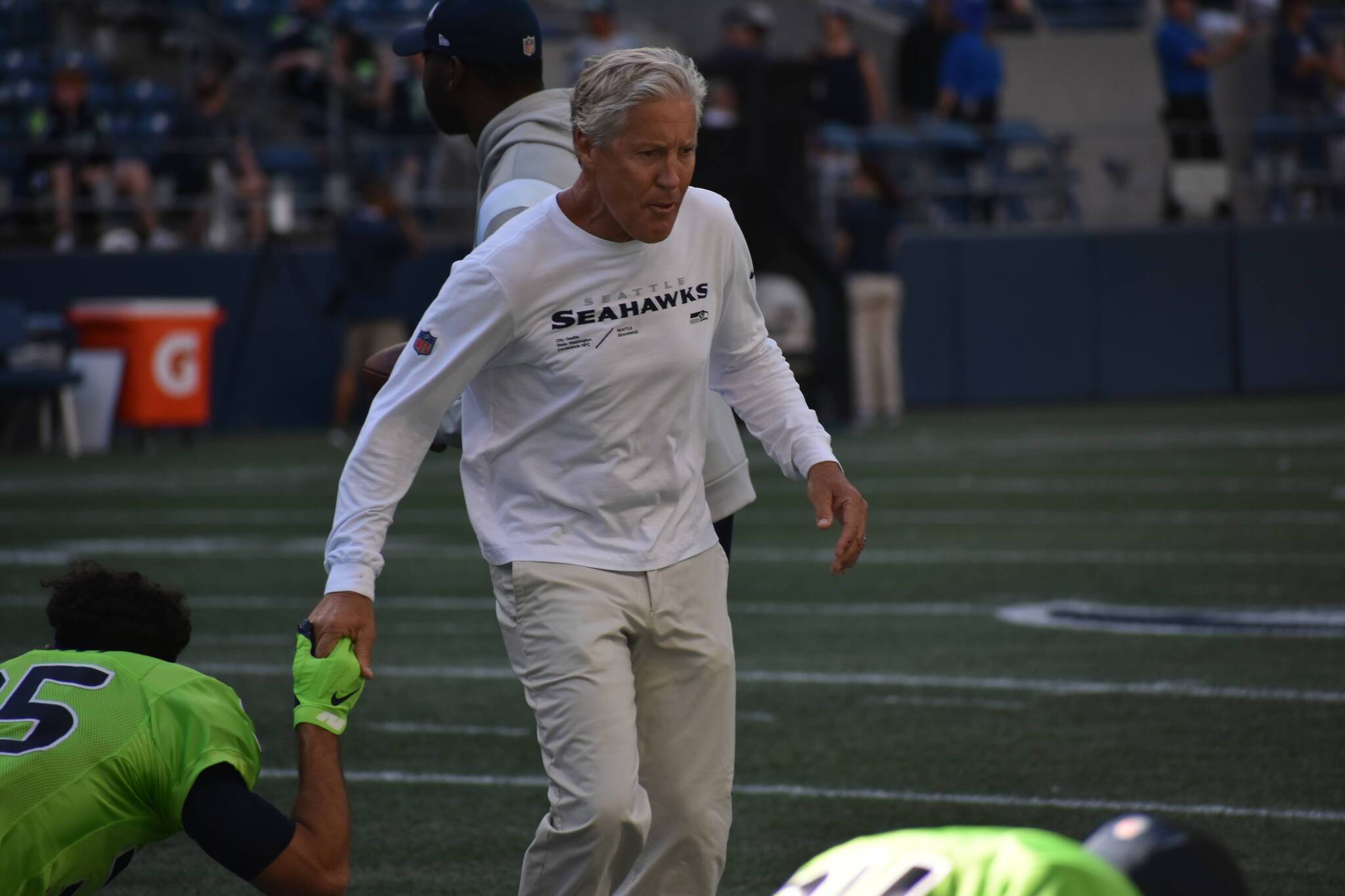 Seahawks Coach Pete Carroll going for a high-five with the defense. (Photos by Ben Ray / Sound Publishing)
