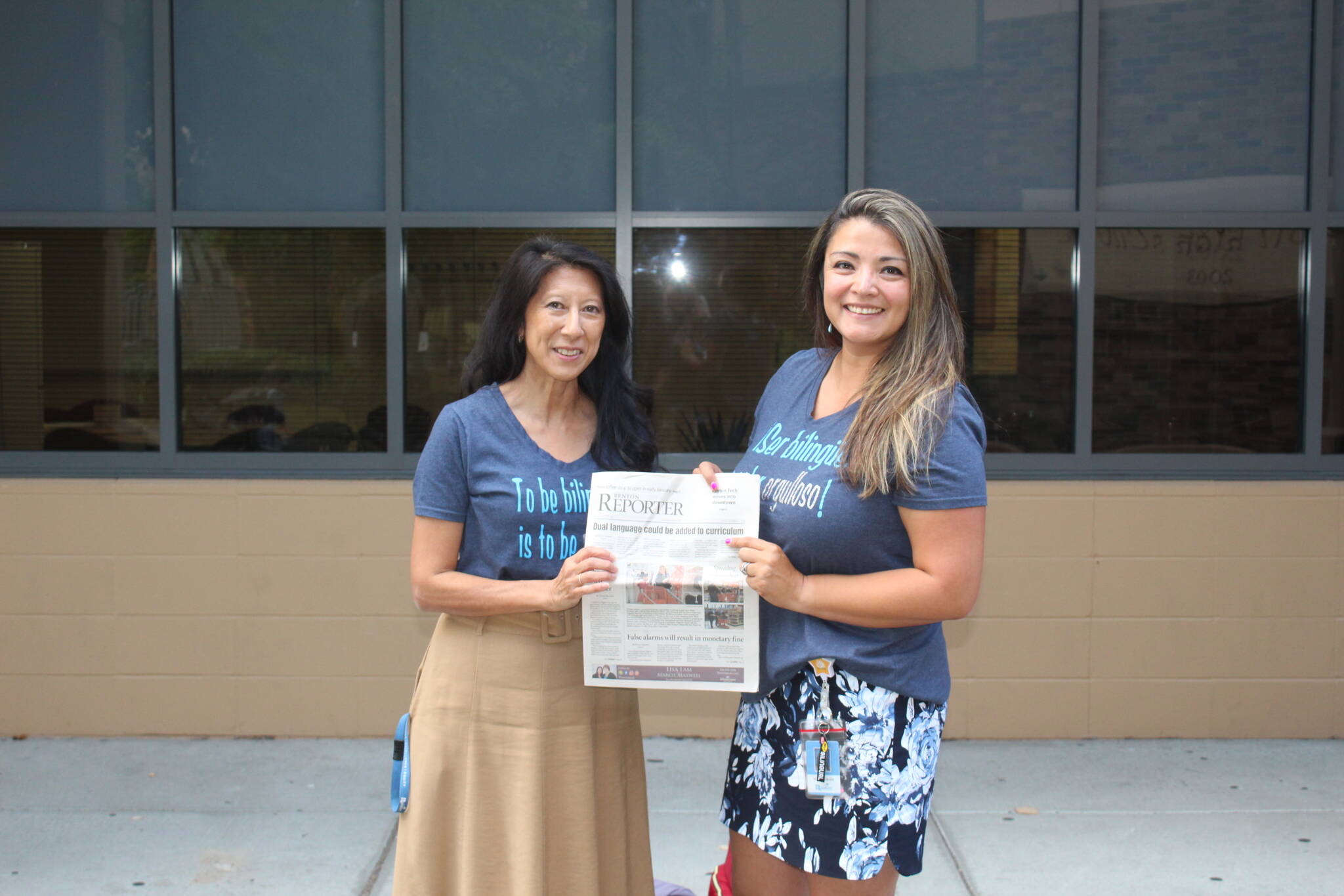 Photo by Annika Hauer/For the Reporter 
Linda Hoste, left, and Norma Taylor, right, holding a 2018 issue of the Renton Reporter.