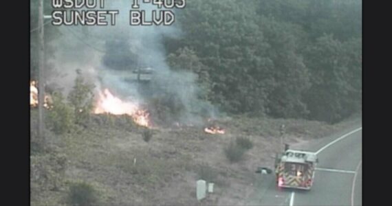 WSDOT highway camera photograph of crews battling the brush fire. (Courtesy of the Renton Fire’s social media)