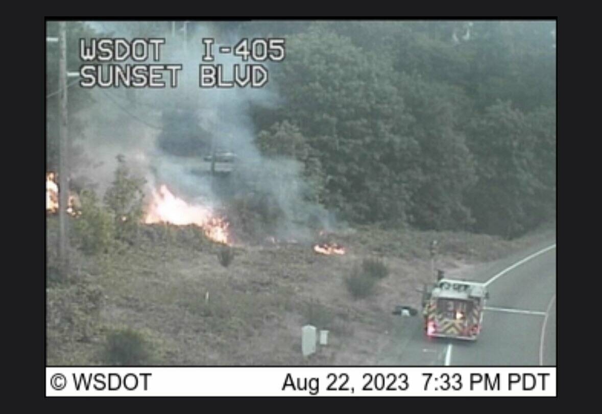 WSDOT highway camera photograph of crews battling the brush fire. (Courtesy of the Renton Fire’s social media)