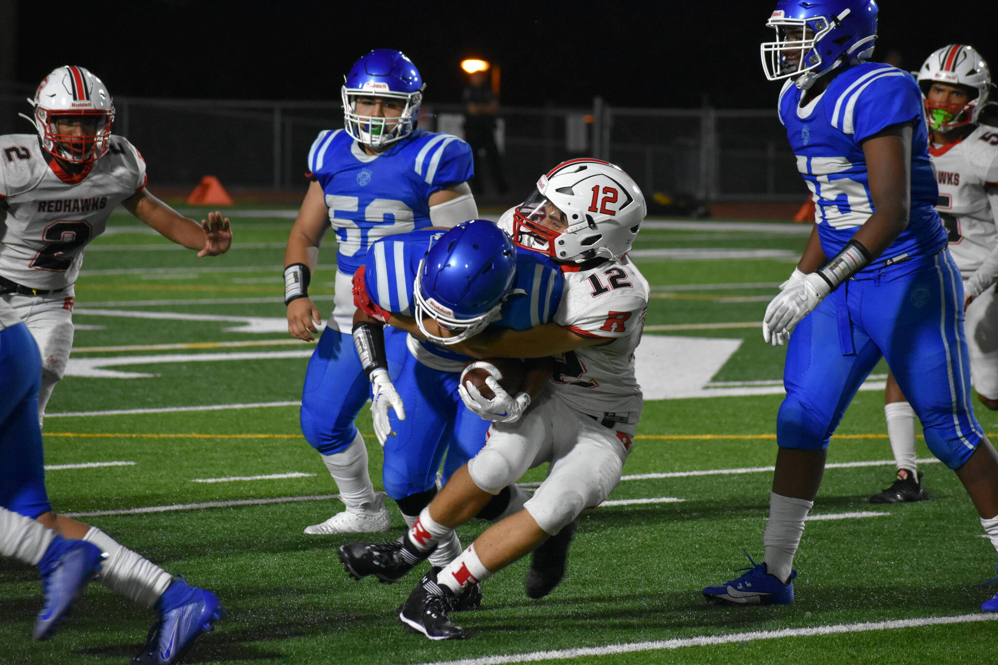 Colln Mickelson makes a tackle against the royals. Ben Ray / The Reporter