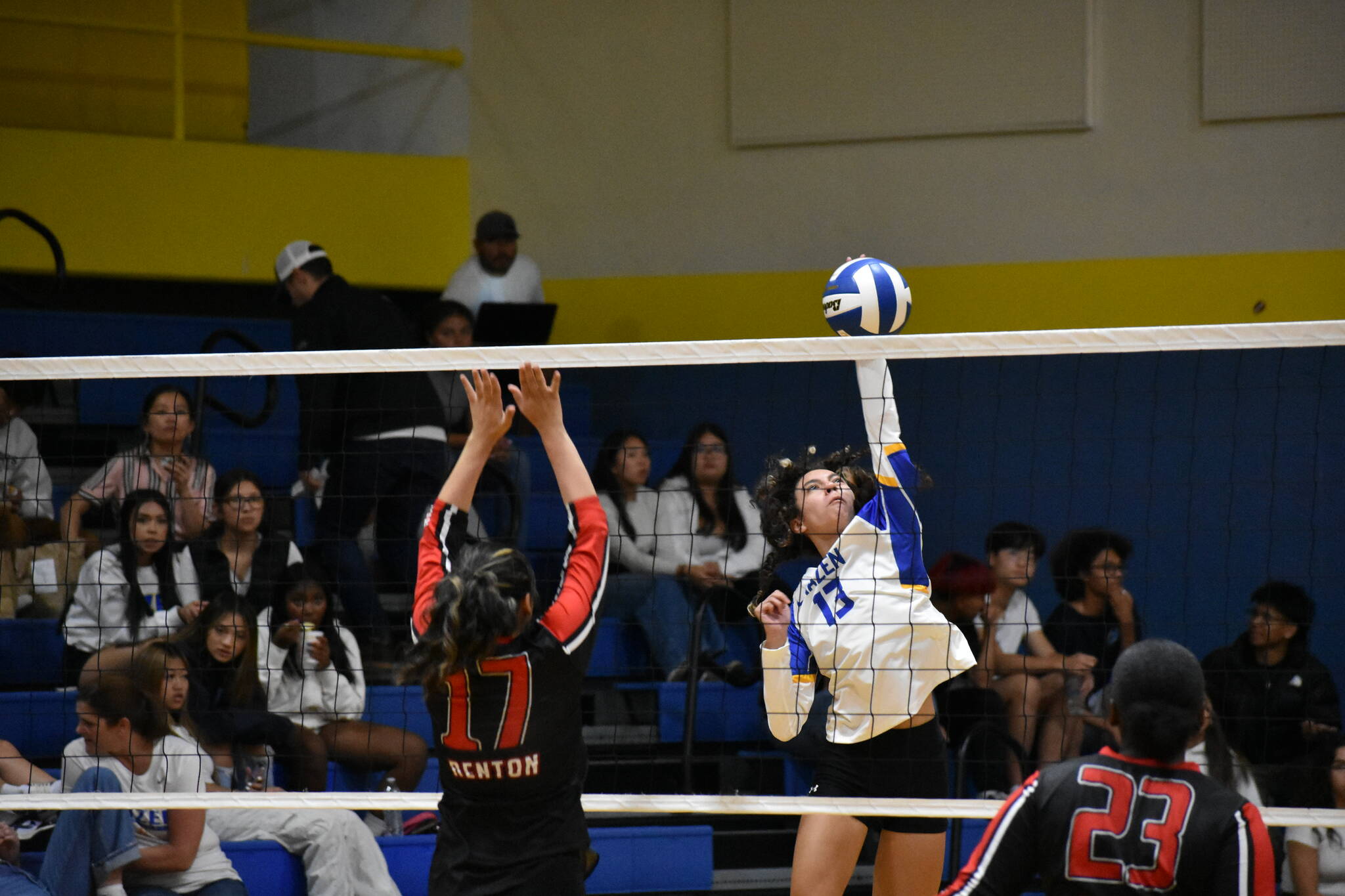 Noelani Kaiwi goes for a kill in against Renton. Ben Ray/ The Reporter