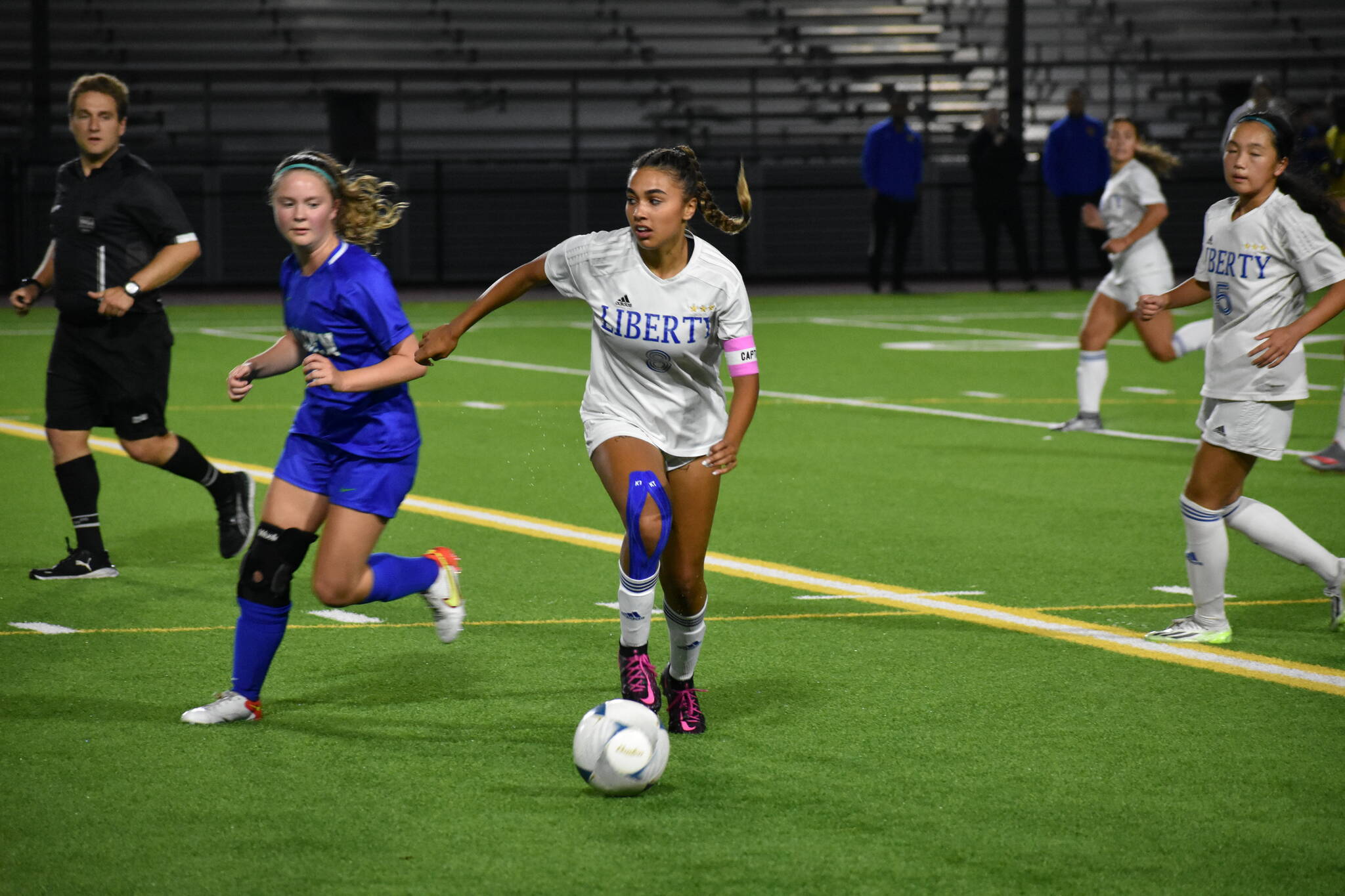 Liberty senior captain Chloe Smith looks for teammates for a pass. Ben Ray / The Reporter