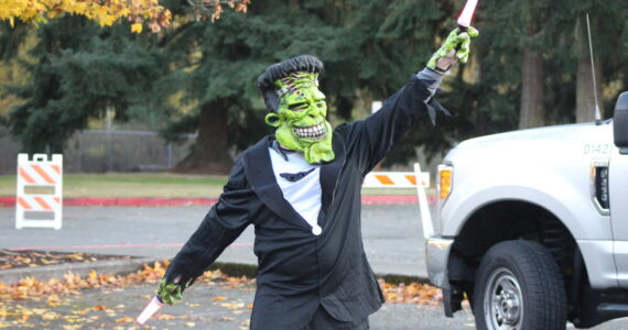Photo by Bailey Jo Josie/Sound Publishing
Frankenstein directs drivers during the 2022 Truck or Treat event.
