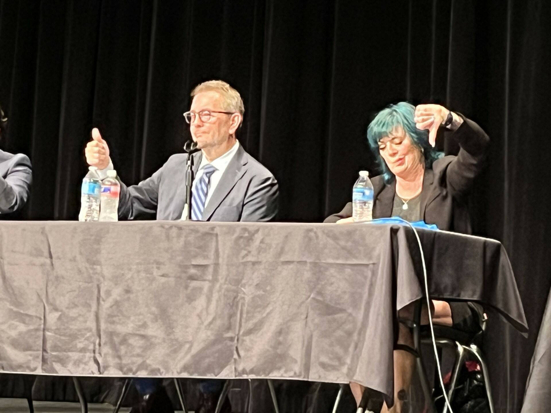 Renton Mayor Armondo Pavone, left, and challenger Kim Monroe Bass at the Renton candidates forum held Sept. 19 at the Carco Theatre. Candidates for council positions 3, 4, 5 and 7 also answered questions about local issues from moderator Diane Dobson of the Renton Chamber of Commerce. (Renton Reporter photo)