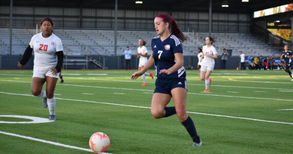 Rachel Ralston dribbles the ball on the way to her first score. Ben Ray / The Reporter