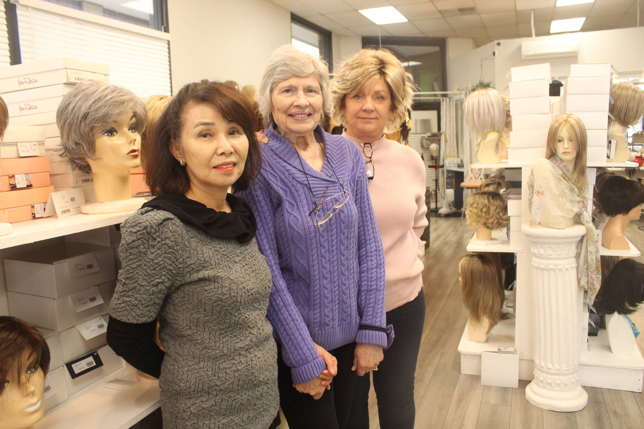 June Paik (left) and her employees at Master Hair Care can work with clients for hours to find the perfect wig or hair piece. Photo by Bailey Jo Josie/Sound Publishing.