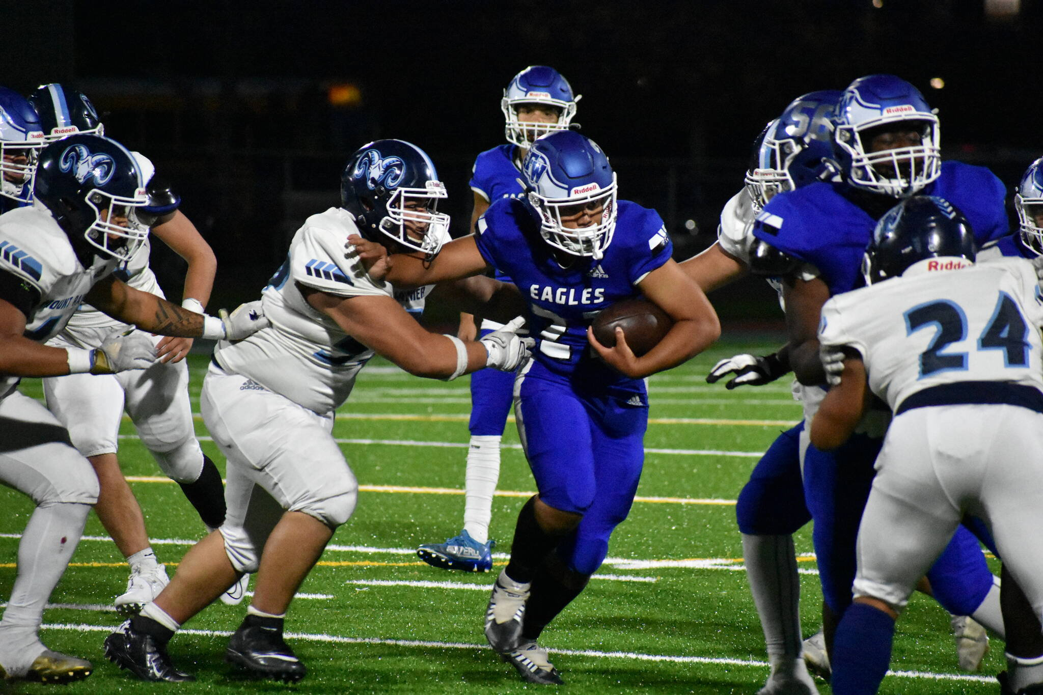 Federal Way’s Sione Kongaika stiff-arms a defender. (Ben Ray/Sound Publishing)
