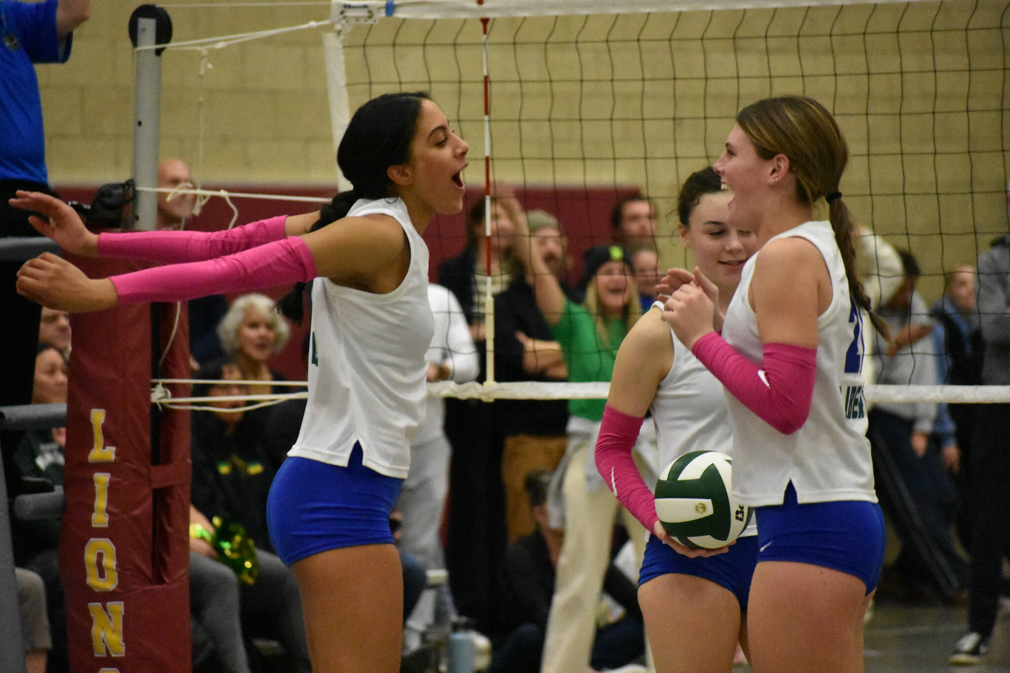 Kendreah Beazer and Layne Ford celebrate a point in the second round of the District 2 3A tournament. Ben Ray / The Reporter