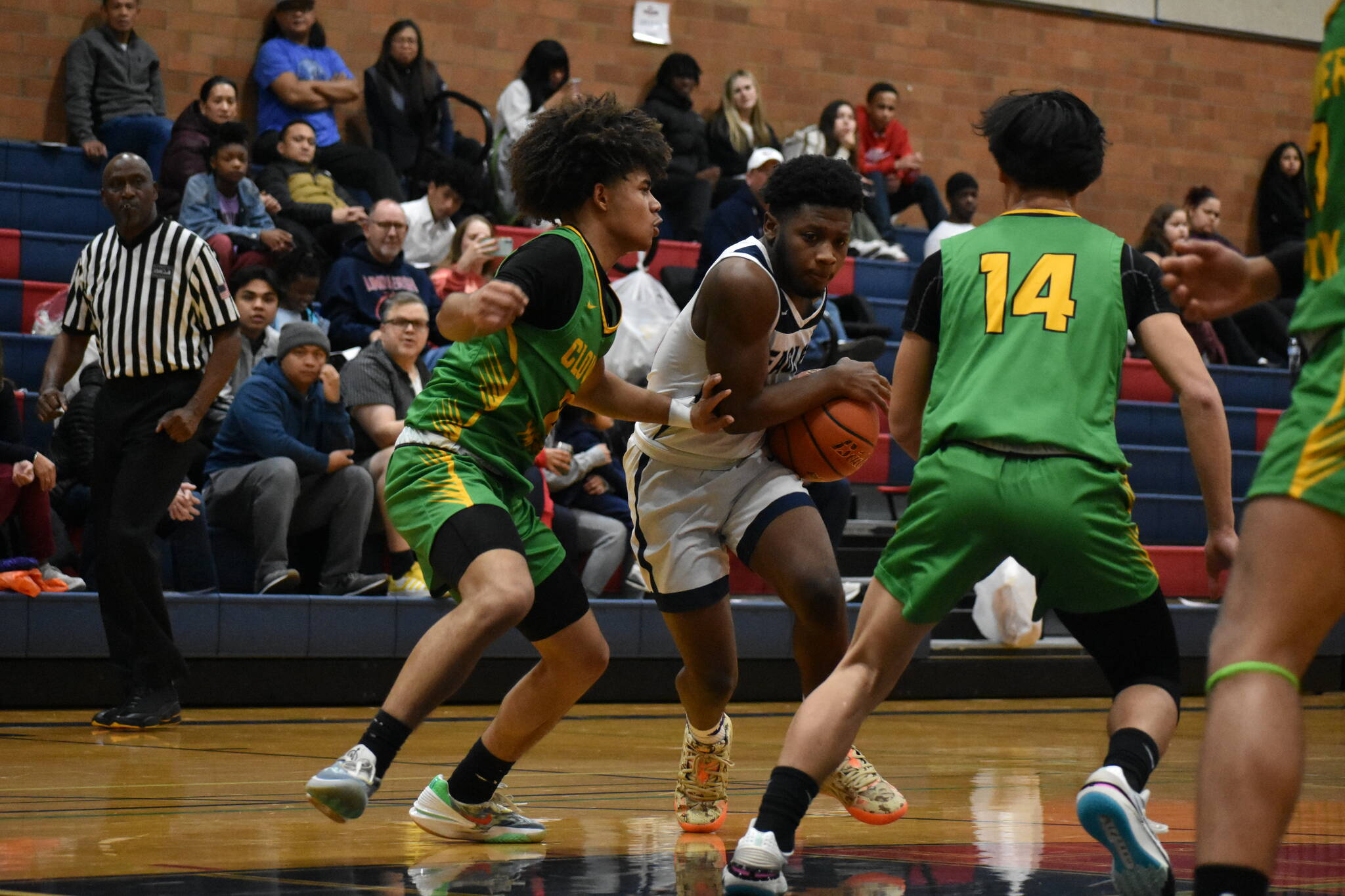 Duly Gilbert drives to the hoop against Clover Park. Ben Ray / The Reporter