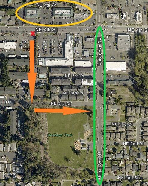 Two suspects ran at the victims from the parking lot across the street, marked by the yellow circle, as the victims exited a apartment complex parking lot, marked by the red X. A subsequent police K9 track of the suspects led officers through the apartment complex, east onto Northeast 3rd Court to Union Avenue Northeast, as marked by the orange arrows. The dogs lost scent of the suspects on Union Avenue Northeast between the 200 and 400 blocks, circled in green. Renton police have requested public assistance in finding surveillance footage of the two suspects in the highlighted areas. (Courtesy of the Renton Police Department.)
