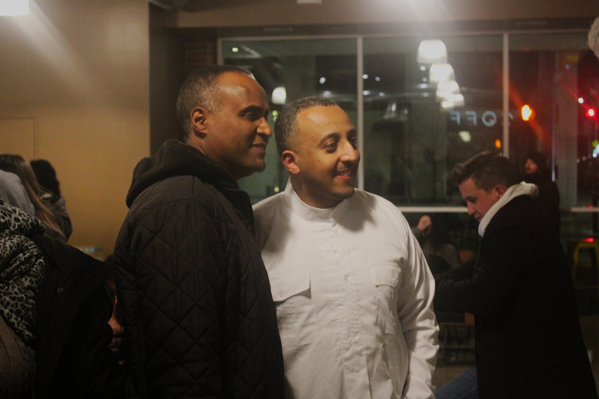 Efrem Fesaha (right) poses for pictures at Boon Boona’s five-year celebration party. (Photo by Bailey Jo Josie/Sound Publishing)
