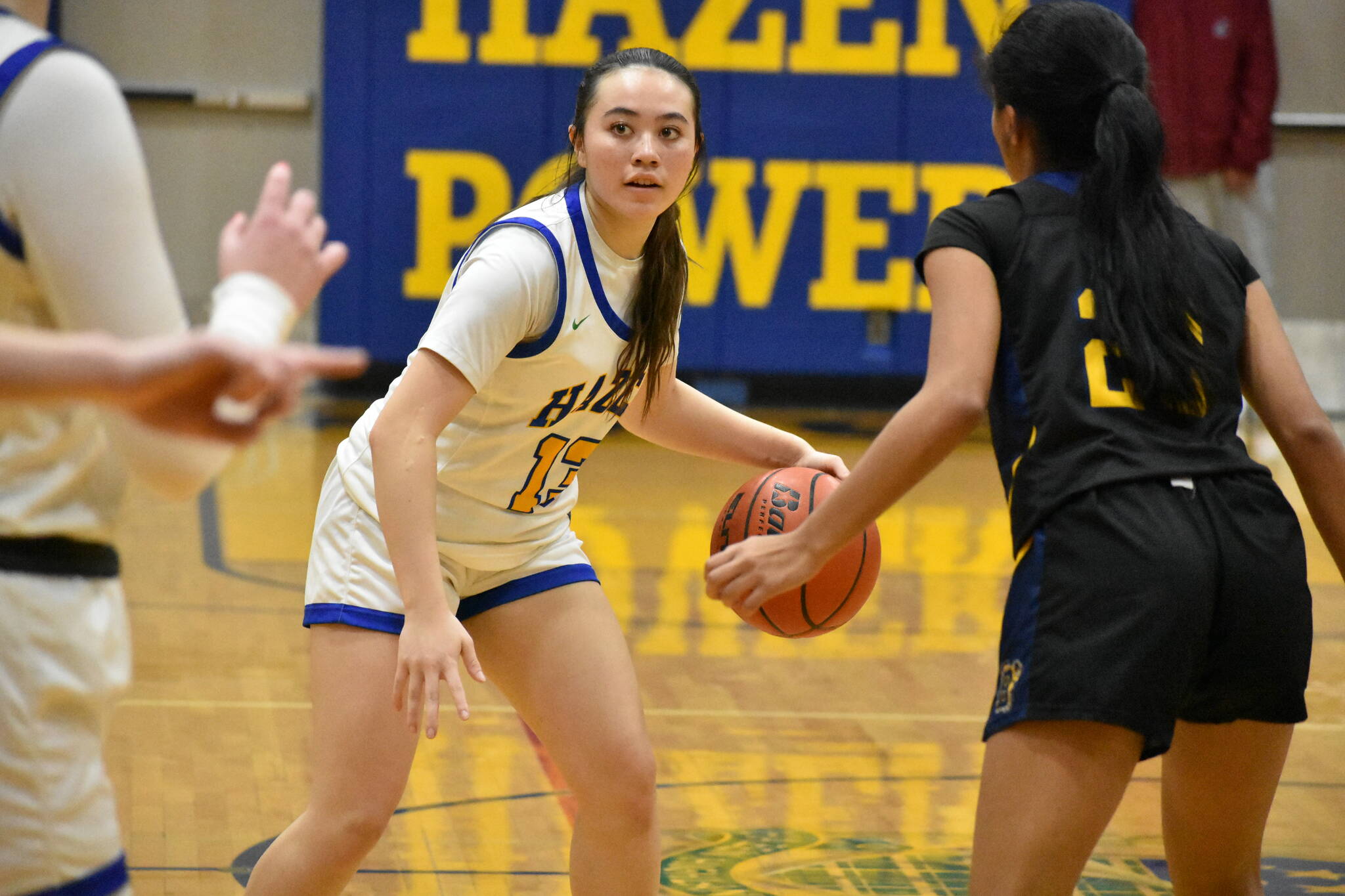 Hazen junior Mia McCarthy looks for a teammate while being guarded by Bellevue. Ben Ray / The Reporter