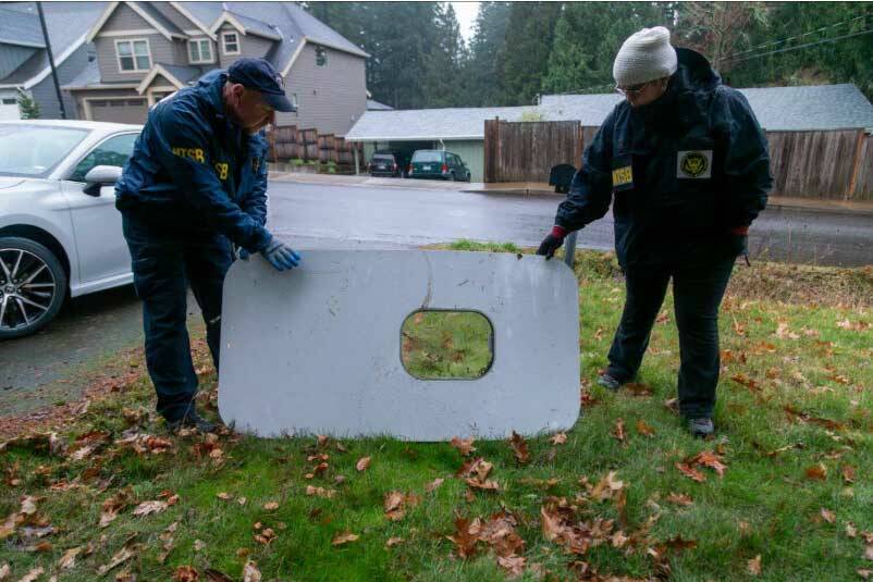 The plane door that flew off of the Alaska Airlines flight 1282 Boeing 737-9 MAX found by NTSB investigators in a Portland resident’s backyard. (Courtesy of NTSB)
