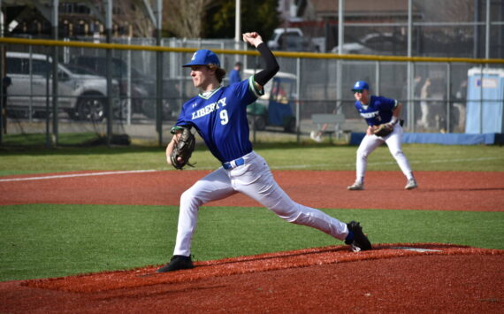 Liberty starting pitcher Wade Treloggen throws a pitch in the first inning. Ben Ray / The Reporter