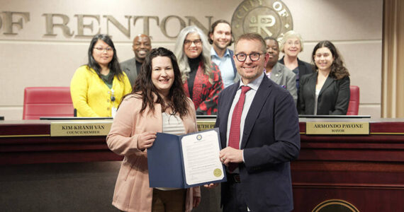 The Renton City Council, Mayor Armondo Pavone, and Kate Krug from the King County Sexual Assault Resource Center pose with the Sexual Assault Awareness Month proclamation. Photo courtesy of the City of Renton