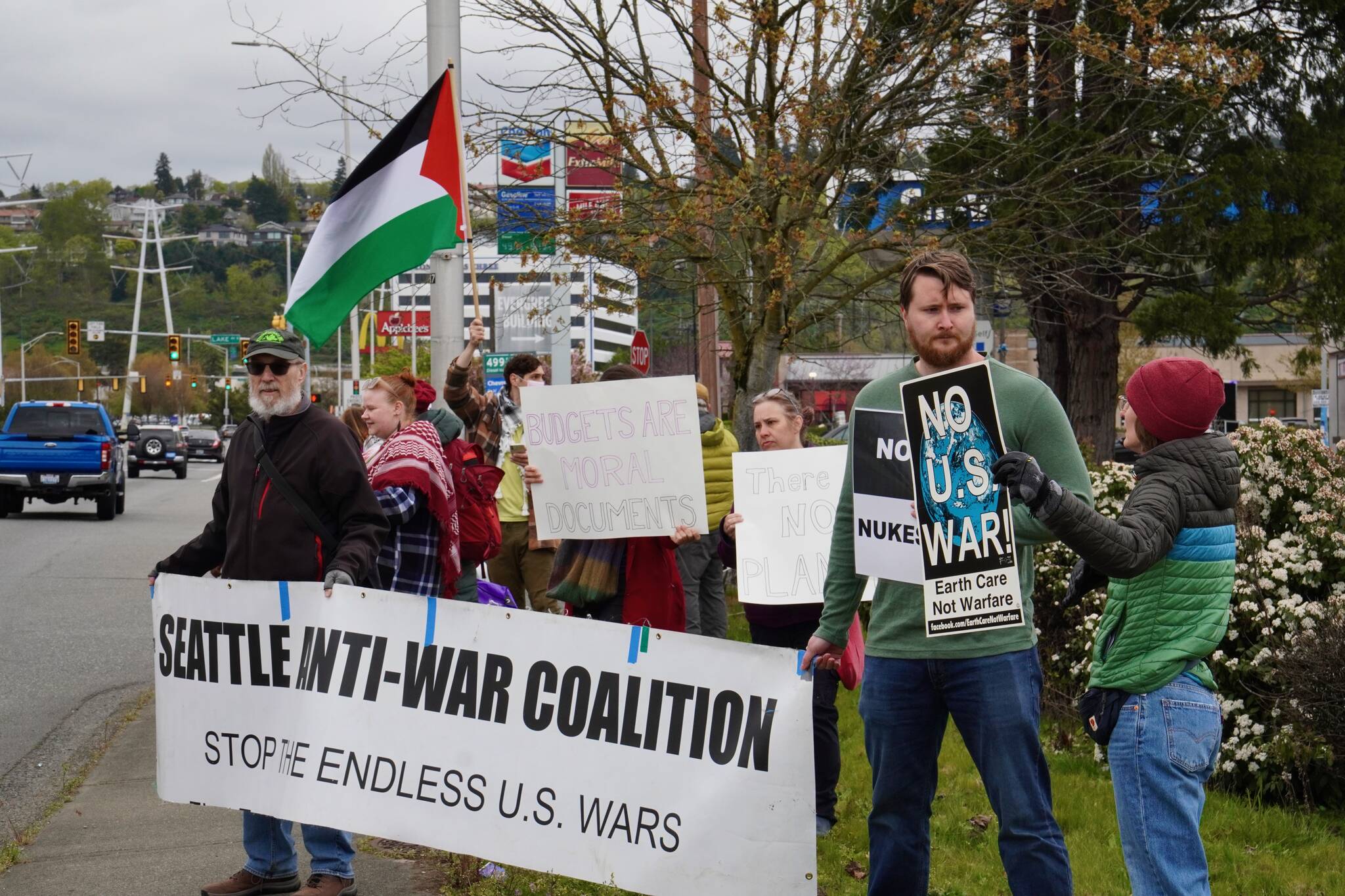 Various members of the Washington Against Nuclear Weapons Coalition and other people protest the Israel-Hamas war on Grady Way. Photo by Joshua Solorzano/Renton Reporter