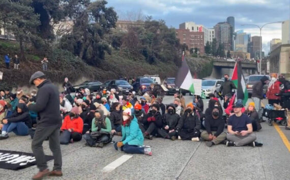 A scene of the Jan. 6, 2024, protest that blocked a freeway on-ramp in Seattle. (Screenshot)