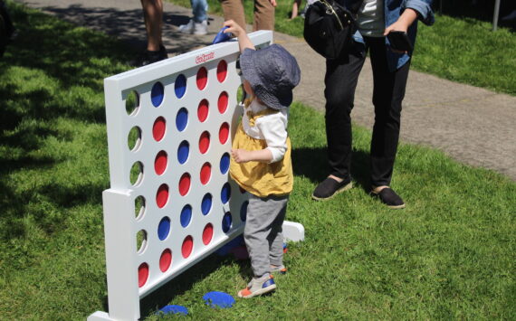 A child playing Connect Four at Earlington Park. Photo by Bailey Jo Josie/Sound Publishing