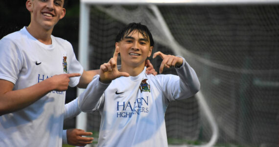 Niko Uzelac and Nathen Song celebrate the first goal for Hazen. Ben Ray / The Reporter