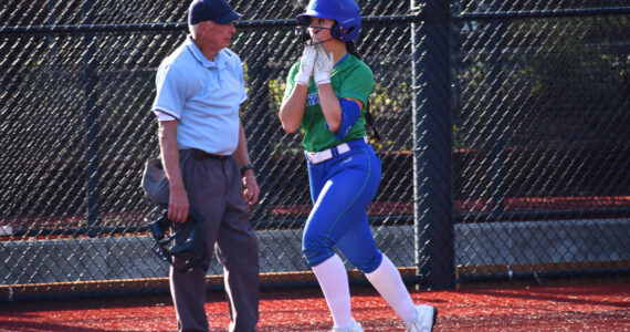 Liberty’s Emi Connell approaches home plate with a smile. Ben Ray / The Reporter