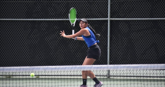 Liberty sophomore Tayler Conway prepares for a forehand shot. Ben Ray / The Reporter
