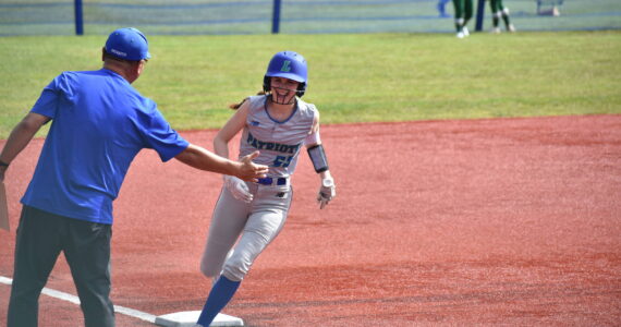 Berlyn Crockett circles the bases after hitting a home run in the first game of the state tournament. Ben Ray / The Reporter