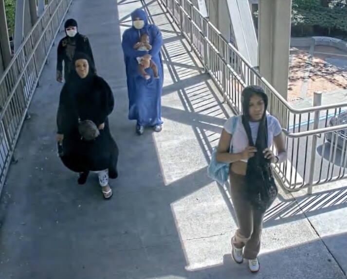 Leavens in the bottom right alongisde other susepcts after leaving Lululemon on Aug. 15, 2023. Screenshot from charging documents.