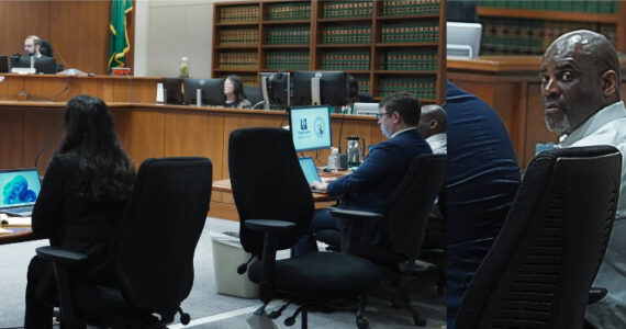 Prosecutor Don Raz indicating to jurors Jerome Jones is in the courtroom and a photo of Jerome Jones. Photo by Joshua Solorzano/Renton Reporter
