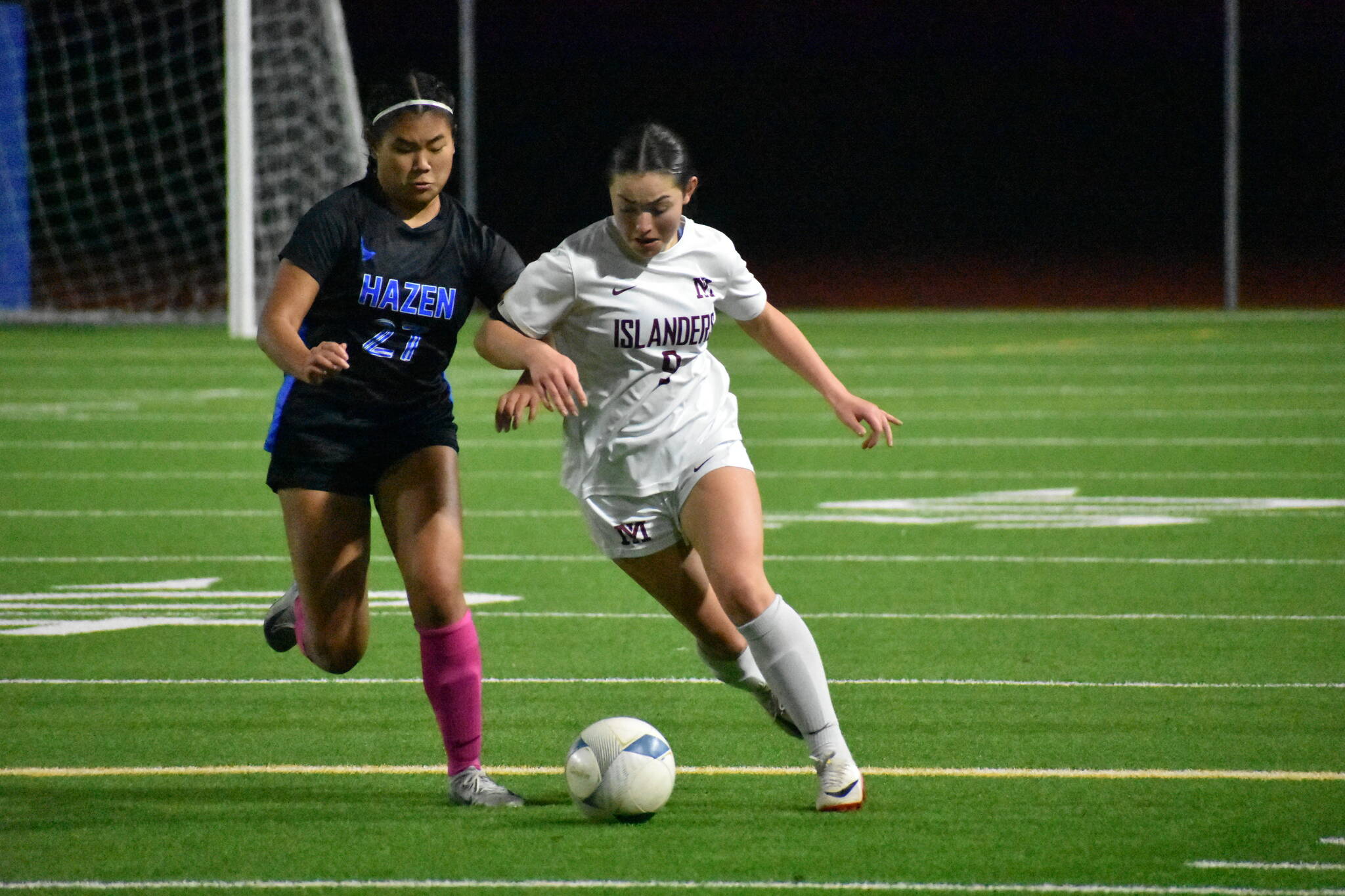Jackie Gonzalez and Zoe Wong battle for the ball. Ben Ray / The Reporter