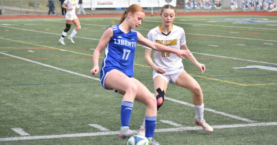 Morgan Ackermann stops the ball for Liberty. Ben Ray / The Reporter