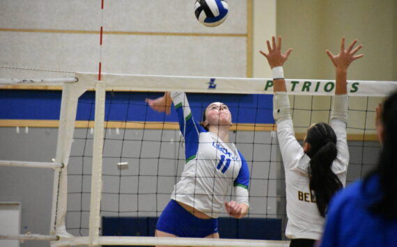 Julianne Lee goes for the kill against Bellevue. Ben Ray / The Reporter