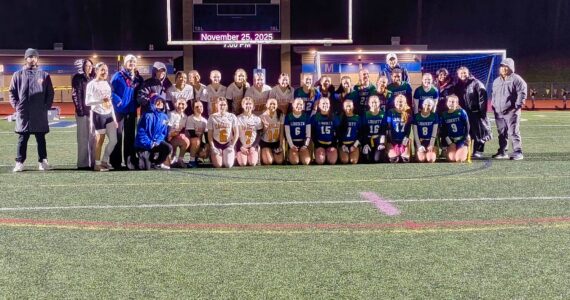 Both Graham Kapowsin and Liberty take a commemorative photo after their inaugural game in the state. Ben Ray / The Reporter
