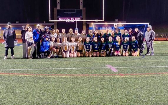 Both Graham Kapowsin and Liberty take a commemorative photo after their inaugural game in the state. Ben Ray / The Reporter