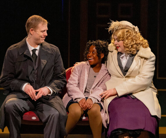Annie is accompanied by Oliver Warbucks and Grace Farrell to the movies. Photo courtesy of Renton Civic Theatre