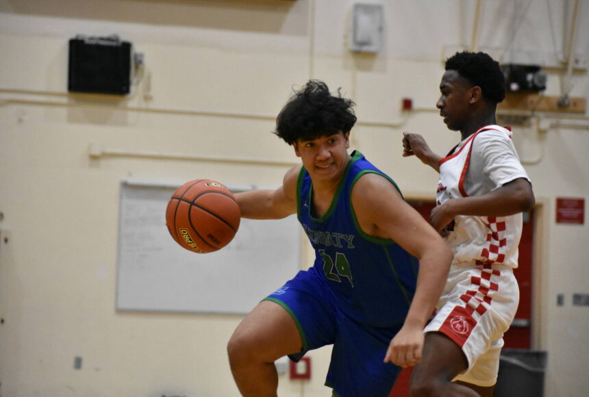 <p>Liberty&rsquo;s Tyson Burley drives to the basket against Renton. Ben Ray / The Reporter</p>