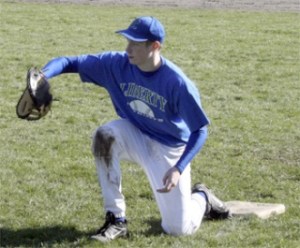 Liberty's John McLeod catches a throw to first base during practice at the Liberty field.