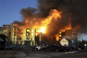 Flames visible for miles destroyed one of the major buildings at the Harrington Square Apartments Tuesday night in the Renton Highlands. Fire crews from Renton