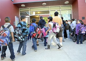 Students enter Honey Dew Elementary School for their first day of classes. This is the first time the school has opened as a full kindergarten through fifth-grade school in about 20 years.
