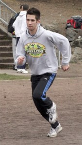 Hazen's Michael McGillivray runs around the track at practice.