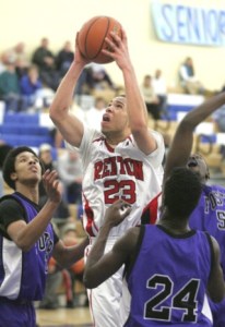 Renton's Joseph Holifield drives the lane in Renton's loss Feb. 26 to Foster at Mount Rainier High School.