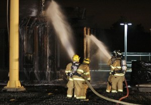 Firefighters battle a fire at a Bonneville Power Administration power station Monday night near Ravensdale. Crews from Skyway and the Boeing Renton plant helped fight the fire.