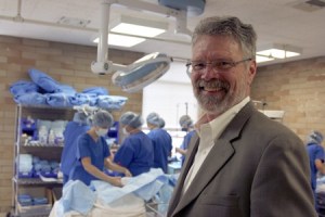 Renton Technical College president Steve Hanson drops in on a classroom in session. Behind him
